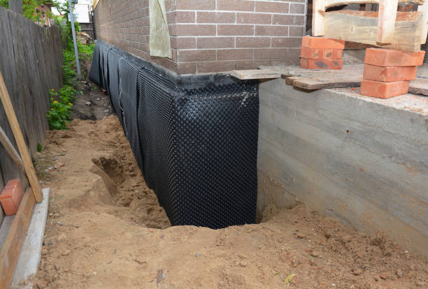 Happy homeowners after waterproofing job in Coopersville
